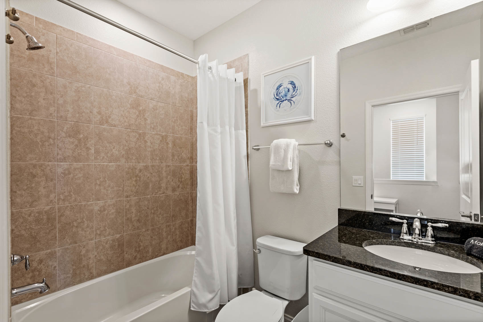 bathroom with dark counter and shower